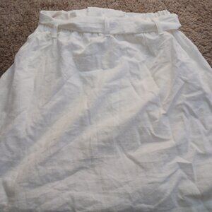 White skirt with brown buttons